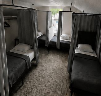 Single beds each surrounded by privacy curtains
